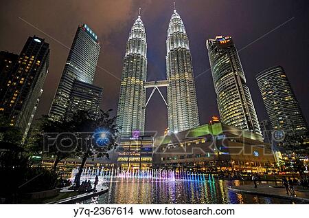 Night time light and water fountain show at KLCC and the Petronas Twin Towers, Kuala Lumpur, Malaysia. View Large Photo Image Picture - Night time light and water fountain show at KLCC and the Petronas Twin Towers, Kuala Lumpur, Malaysia.. Fotosearch