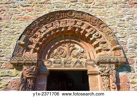Norman Romanesque relief sculptures of dragons and mythical creatures depicting the struggle between good and evil, from the South doorway of Church of St Mary and St David, Kilpeck Herifordshire, England. Built around 1140. View Large Photo Image Stock Photograph - Norman Romanesque relief sculptures of dragons and mythical creatures depicting the struggle between good and evil, from the South doorway of Church of St Mary and St David, Kilpeck Herifordshire, England. Built around 1140.. Fotosearch