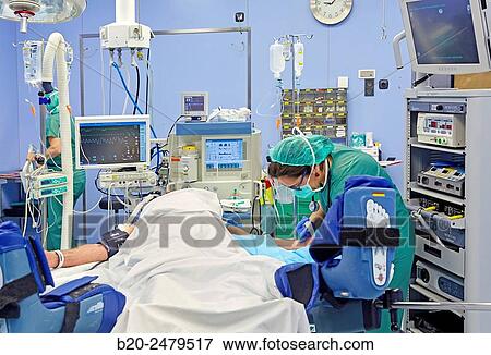 Stock Photo - Operating room, Prostate cancer robotic surgery, Da Vinci surgical robot, Urology, Hospital Donostia, San Sebastian, Gipuzkoa, Basque Country, Spain. Fotosearch