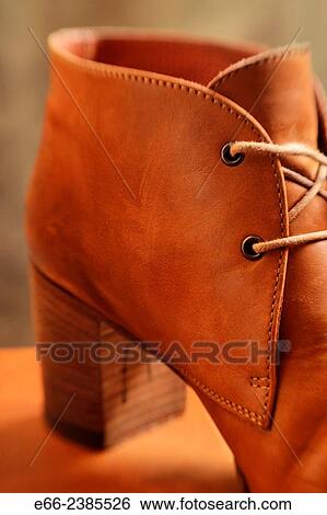 pair of women's boots with laces undone. View Large Photo Image Stock Photograph - pair of women's boots with laces undone.. Fotosearch