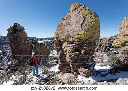 Stock Image - Photographer shootin Rhyolite Hoodoos, Chiricahua National Monument, Arizona.. Fotosearch