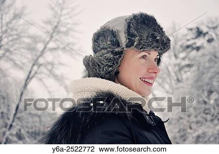Portrait of a smiling mid adult woman, winter View Large Photo Image Stock Image - Portrait of a smiling mid adult woman, winter. Fotosearch