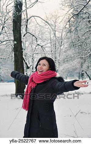 Stock Photo - Portrait of a smiling mid adult woman, winter. Fotosearch
