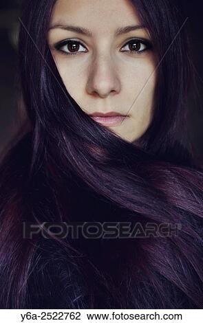 Stock Image - Portrait of a young woman.. Fotosearch