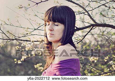 Portrait of mid adult woman, eyes closed, spring View Large Photo Image Stock Image - Portrait of mid adult woman, eyes closed, spring. Fotosearch