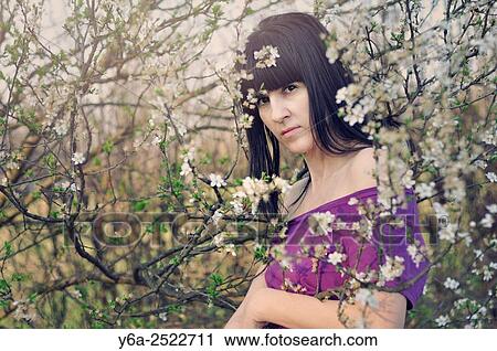 Portrait of mid adult woman, spring View Large Photo Image Stock Image - Portrait of mid adult woman, spring. Fotosearch