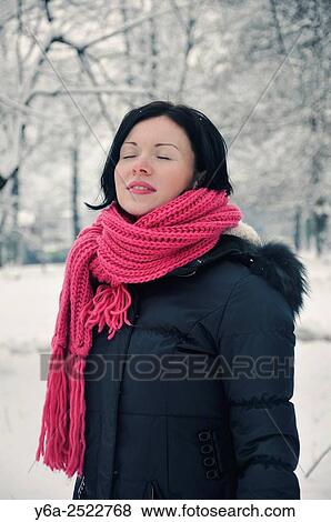 Stock Photo - Portrait of mid adult woman, winter. Fotosearch