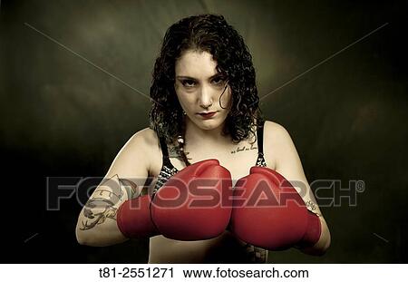 Portrait of tattooed girl with boxing gloves. In, Spain View Large Photo Image Stock Image - Portrait of tattooed girl with boxing gloves. In, Spain. Fotosearch