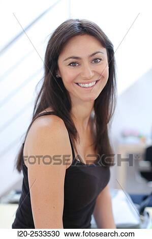 Portrait of woman, smiling View Large Photo Image Stock Image - Portrait of woman, smiling. Fotosearch