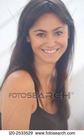 Portrait of woman, smiling View Large Photo Image Stock Photo - Portrait of woman, smiling. Fotosearch