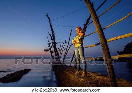 Stock Photo - Posing young woman crossed hands. Fotosearch
