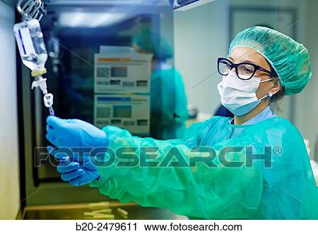 Stock Image - Preparation of drugs in laminar flow hood, epidural anesthesia, Clean room, Pharmacy, Hospital Donostia, San Sebastian, Gipuzkoa, Basque Country, Spain. Fotosearch