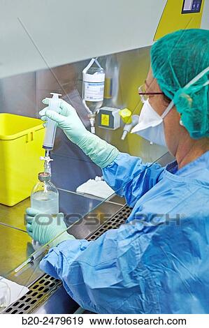 Stock Photo - Preparation of drugs in laminar flow hood, epidural anesthesia, Clean room, Pharmacy, Hospital Donostia, San Sebastian, Gipuzkoa, Basque Country, Spain. Fotosearch