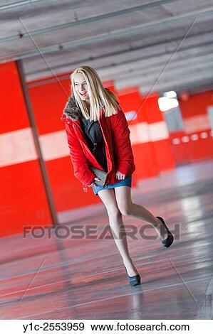 Stock Photo - Pretty teen girl in Red jacket excited. Fotosearch