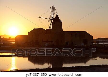 Saltworks and the picturesque windmill at the Stagnone lagoon, Marsala, Sicily, Italy, Europe. View Large Photo Image Stock Image - Saltworks and the picturesque windmill at the Stagnone lagoon, Marsala, Sicily, Italy, Europe.. Fotosearch