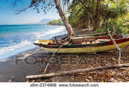 Seashore landscape and fishing boat. Flores island. Indonesia, Asia. View Large Photo Image Stock Photo - Seashore landscape and fishing boat. Flores island. Indonesia, Asia.. Fotosearch