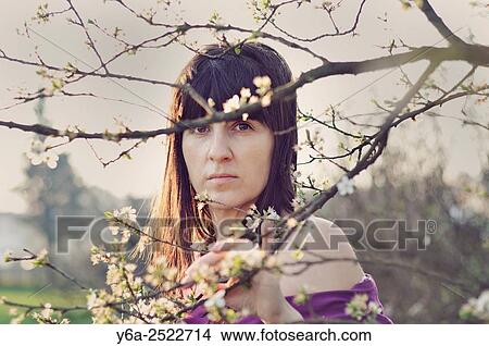 Serious mid adult woman portrait, spring View Large Photo Image Picture - Serious mid adult woman portrait, spring. Fotosearch