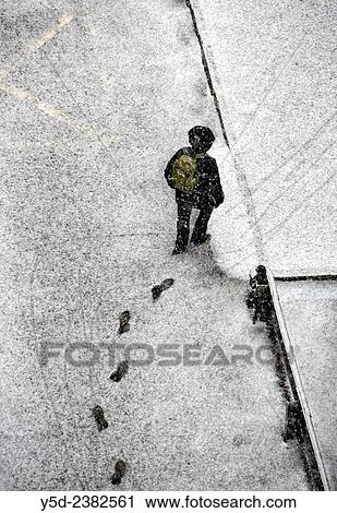 single person waliking street covered with fresh snow leaving footprints in the snow, Geneva, Switzerland. View Large Photo Image Stock Image - single person waliking street covered with fresh snow leaving footprints in the snow, Geneva, Switzerland.. Fotosearch