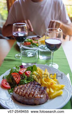 Sirloin steak with salad and chips in a restaurant. Madrid province, Spain. View Large Photo Image Stock Photography - Sirloin steak with salad and chips in a restaurant. Madrid province, Spain.. Fotosearch