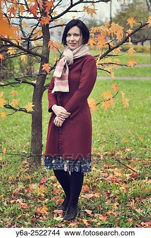 Picture - Smiling mid adult woman portrait, autumn. Fotosearch