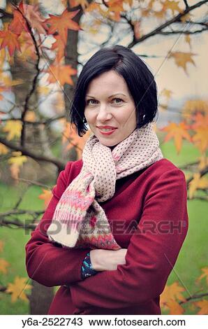 Smiling mid adult woman portrait, autumn View Large Photo Image Stock Image - Smiling mid adult woman portrait, autumn. Fotosearch