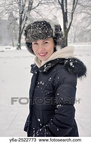 Smiling mid adult woman portrait, winter View Large Photo Image Stock Image - Smiling mid adult woman portrait, winter. Fotosearch