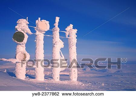 Stock Image - Snow and ice covered telecommunication towers, Skalafell Mountain, Iceland.. Fotosearch