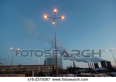 Street lamps on in a parking lot at dusk, with Grozavesti Power Station in the background - Bucharest, Romania, Europe, Eastern Europe. View Large Photo Image Stock Photo - Street lamps on in a parking lot at dusk, with Grozavesti Power Station in the background - Bucharest, Romania, Europe, Eastern Europe.. Fotosearch