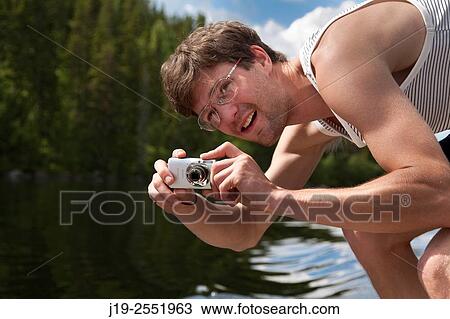 Stock Image - Summer cottage holiday brothers, J? mtland, Sweden brothers boat ride, sailing. Fotosearch