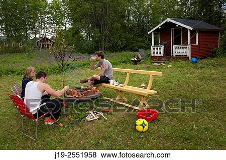 Summer cottage holiday brothers, J? mtland, Sweden family dinner View Large Photo Image Stock Photo - Summer cottage holiday brothers, J? mtland, Sweden family dinner. Fotosearch