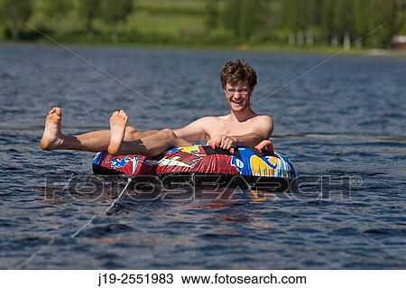 Stock Image - Summer cottage holiday J? mtland Sweden family bath, swimming. boat ride. Fotosearch