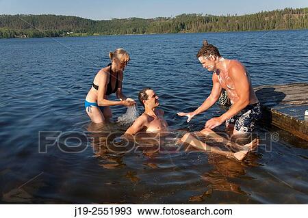 Summer cottage holiday J? mtland Sweden family bath, swimming View Large Photo Image Stock Image - Summer cottage holiday J? mtland Sweden family bath, swimming. Fotosearch