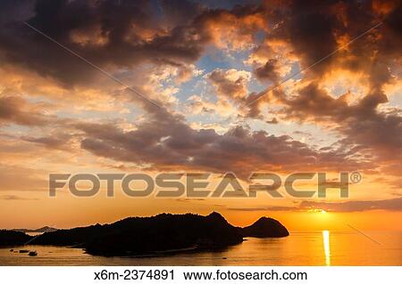 Stock Image - Sunset in Labuan Bajo town. Flores island. Indonesia, Asia.. Fotosearch
