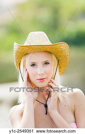 Stock Image - Teen girl blonde portrait with stetson hat. Fotosearch