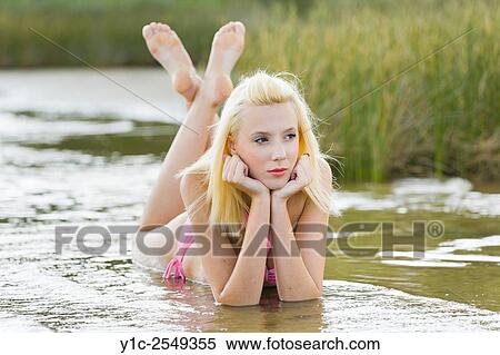 Teen girl in shallow water View Large Photo Image Stock Photography - Teen girl in shallow water. Fotosearch