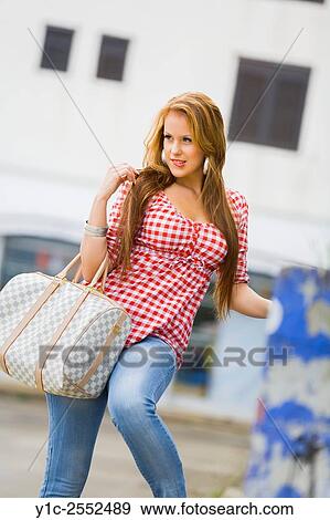 Stock Photo - Teen girl is hesitating. Fotosearch