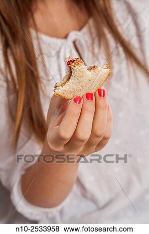 Teenage girl eating a sandwich. View Large Photo Image Stock Photo - Teenage girl eating a sandwich.. Fotosearch