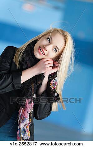 Teenager blonde girl putting on ear-ring View Large Photo Image Stock Photo - Teenager blonde girl putting on ear-ring. Fotosearch