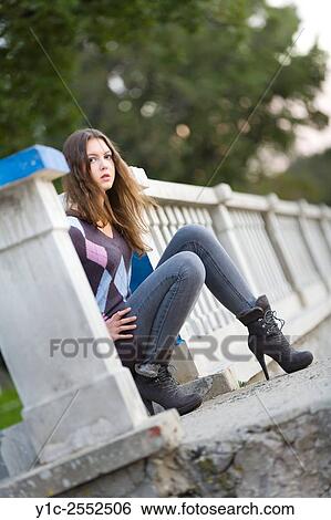 Teenager girl outdoors and pants and ankle-boots View Large Photo Image Stock Photograph - Teenager girl outdoors and pants and ankle-boots. Fotosearch