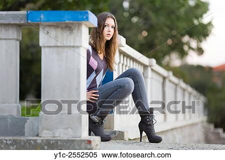 Stock Photography - Teenager girl outdoors and pants and ankle-boots. Fotosearch