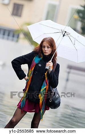 Teenager girl under White umbrella on rainy day View Large Photo Image Stock Photography - Teenager girl under White umbrella on rainy day. Fotosearch