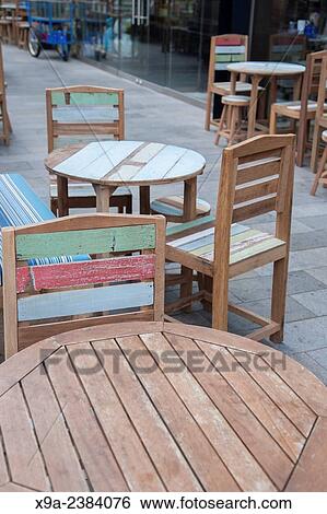 Terrace Cafe Table and Chairs outside Thaikhun Restaurant; Spinningfields District; Manchester; England; UK. View Large Photo Image Stock Photograph - Terrace Cafe Table and Chairs outside Thaikhun Restaurant; Spinningfields District; Manchester; England; UK.. Fotosearch