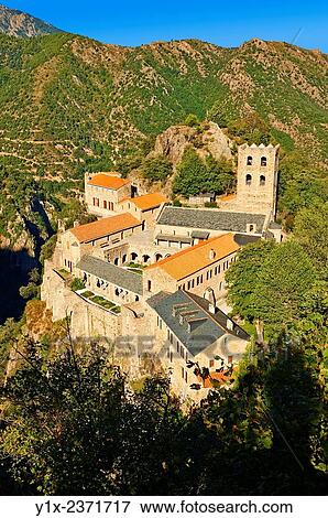 The First or Lombard Romanesque style Abbey of Saint Martin-du-Canigou in the Pyrenees, Orientales department, France. View Large Photo Image Stock Photo - The First or Lombard Romanesque style Abbey of Saint Martin-du-Canigou in the Pyrenees, Orientales department, France.. Fotosearch