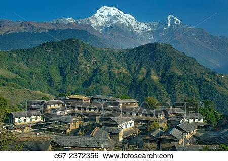 The Mountain village of Ghandruk in the Modi Khola Valley at around 2000 metres with Annapurna South and Fishtail in the distance. View Large Photo Image Stock Photograph - The Mountain village of Ghandruk in the Modi Khola Valley at around 2000 metres with Annapurna South and Fishtail in the distance.. Fotosearch