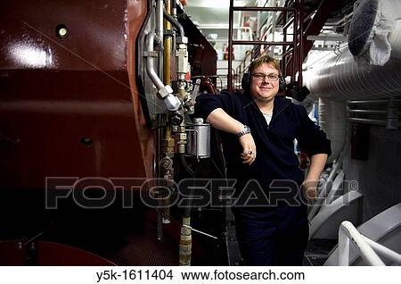 The second engineer of container-vessel MV Flintercape controls the engine-room of the vessel during absence of the first engineer. The ship is sailing from Rotterdam, Netherlands to Sundsvall, Sweden. View Large Photo Image Picture - The second engineer of container-vessel MV Flintercape controls the engine-room of the vessel during absence of the first engineer. The ship is sailing from Rotterdam, Netherlands to Sundsvall, Sweden.. Fotosearch