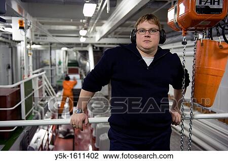 The second engineer of container-vessel MV Flintercape controls the engine-room of the vessel during absence of the first engineer. The ship is sailing from Rotterdam, Netherlands to Sundsvall, Sweden. View Large Photo Image Stock Image - The second engineer of container-vessel MV Flintercape controls the engine-room of the vessel during absence of the first engineer. The ship is sailing from Rotterdam, Netherlands to Sundsvall, Sweden.. Fotosearch