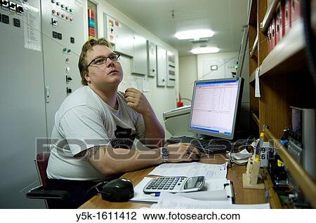 The second engineer of container-vessel MV Flintercape controls the engine-room of the vessel during absence of the first engineer. The ship is sailing from Rotterdam, Netherlands to Sundsvall, Sweden. View Large Photo Image Stock Image - The second engineer of container-vessel MV Flintercape controls the engine-room of the vessel during absence of the first engineer. The ship is sailing from Rotterdam, Netherlands to Sundsvall, Sweden.. Fotosearch