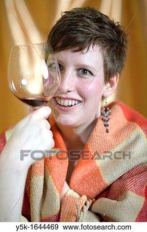 Tilburg, Netherlands. Young woman with plaid and glass of wine. View Large Photo Image Stock Photo - Tilburg, Netherlands. Young woman with plaid and glass of wine.. Fotosearch