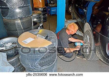 Tire Change. View Large Photo Image Stock Photograph - Tire Change.. Fotosearch