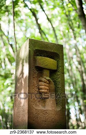 Tombstone with hand holding mallot representing glorified Communist worker, Jewish cemetery, Warsaw, Poland, Europe. View Large Photo Image Stock Photo - Tombstone with hand holding mallot representing glorified Communist worker, Jewish cemetery, Warsaw, Poland, Europe.. Fotosearch
